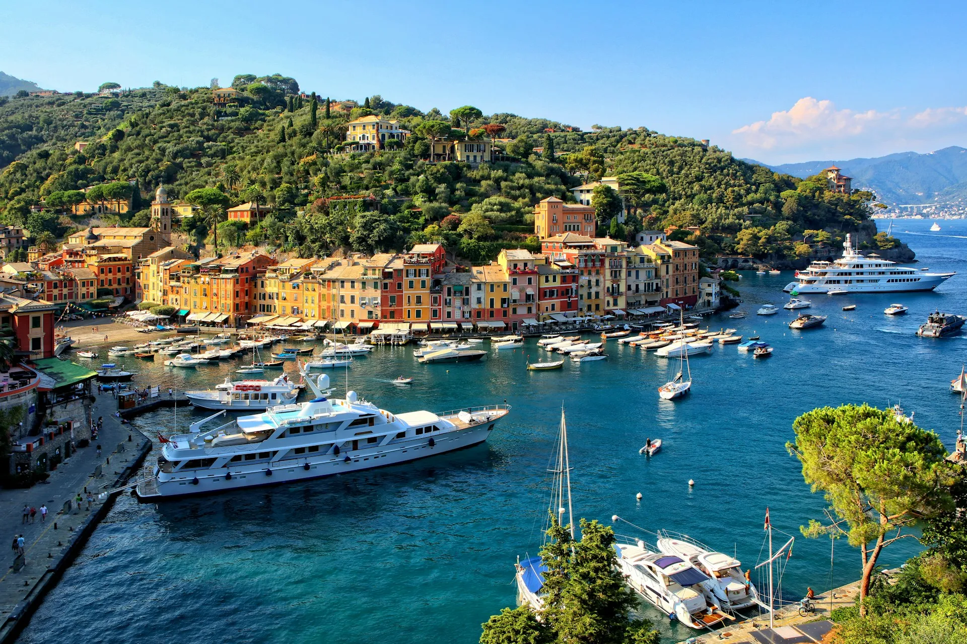 Portofino's pastel harbour ringed with boats on the Italian Riviera